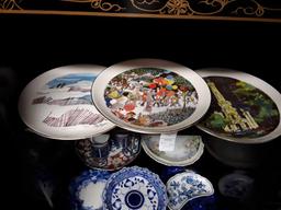 Lot of decorative plates and items. Includes blue and white