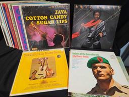 Vintage LP vinyls, including Hank Williams, the girl from ipanema, rods and rails drag strip sounds.