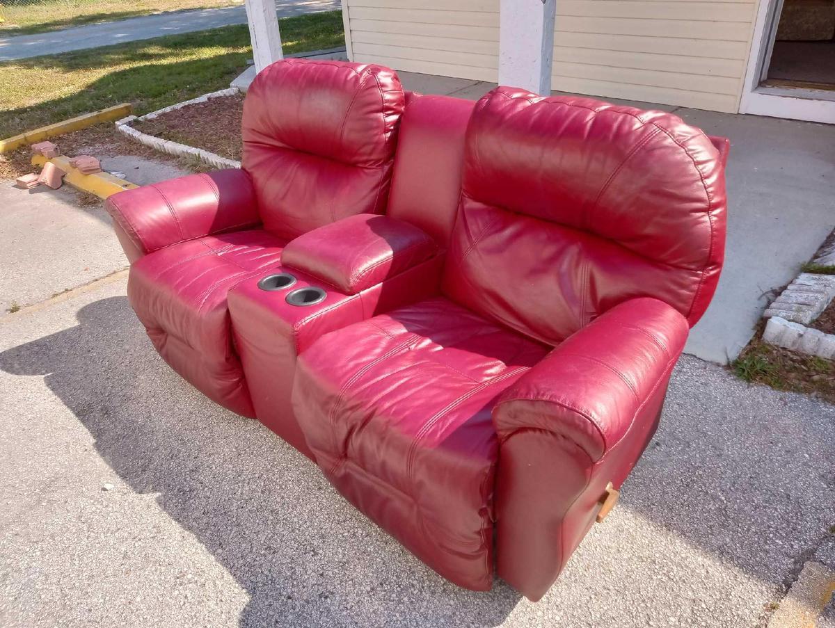 DEEP RED DUAL ROCKER RECLINER WITH CENTER CONSOLE STORAGE AND CUP HOLDERS