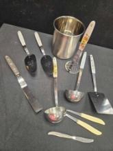 Vintage kitchen utensils, modern metal bucket