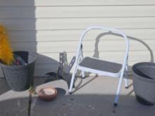 Outdoor grouping, including hefty hose holder pots and step ladder