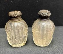 Pair of antique Victorian? crystal salt and pepper shakers with sterling silver? tops