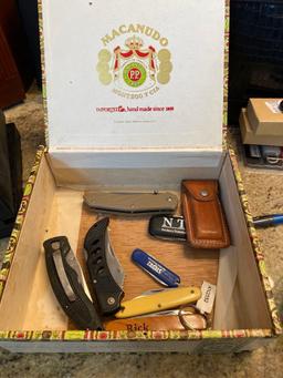 Cigar box with 8 pocket knives