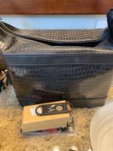 Travel lot includes Vinyl alligator type bag, Victoria cruises keychains and master lock luggage