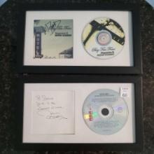 Two framed autographed CDs