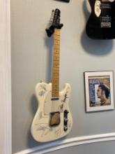 Electric guitar autographed by multiple stars including Peter Frampton, James Young and more