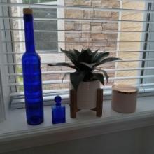 Small Group of Decor including Cobalt Blue Bottles and Candle