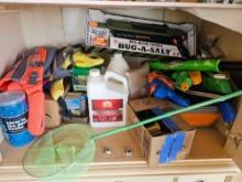 Shelf lot - New BUG-A-SALT Fly Eradicator, yard chemicals, flags, glow in the dark rocks, more