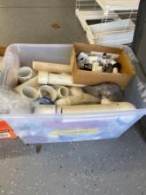 Tote full of fittings and plumbing supplies