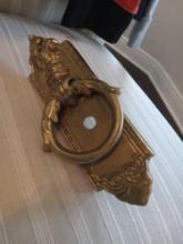 Antique brass door knocker, likely from the Victorian or Art Nouveau Style