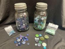 two vintage Ball Mason jars with zinc lids, filled with a collection of assorted vintage buttons