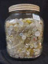 Jar filled with Assorted Vintage buttons, likely materials such as bone, glass, and mother of pearl