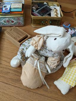 Tins of Sewing Notions, Dolls, Framed Verse, Decorations and Table Lamp