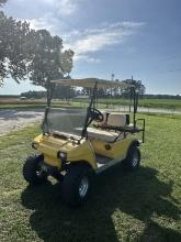 Yellow Club Car gas golf cart