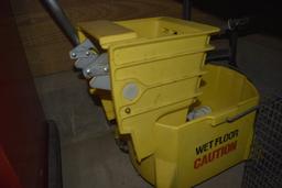 Yellow industrail mop bucket