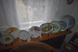 3 john deere plates, group of plates on sill, other plates, decorative wall hanger