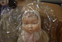 Box of Dolls and Knit Table Clothes