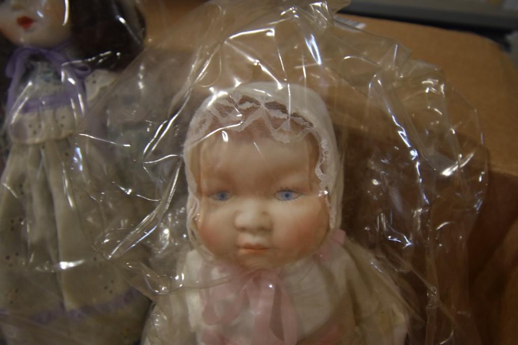 Box of Dolls and Knit Table Clothes