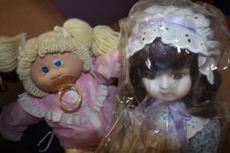 Box of Dolls and Knit Table Clothes