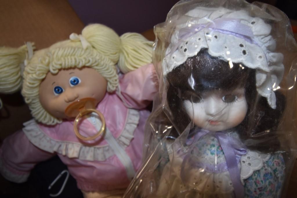 Box of Dolls and Knit Table Clothes
