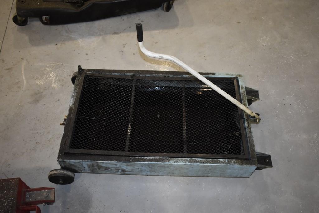Under Truck Oil Pan on Wheels