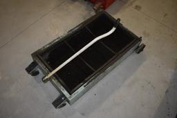 Under Truck Oil Pan on Wheels