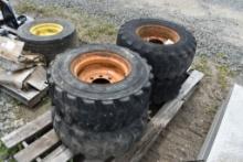 4 Used 12.16.5 Skid Steer Tires on 8 Lug Rims