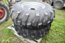Pair of titan 16.9-24 Ag tires on 8 Lug Rims