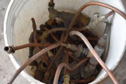 Bucket of Pipe Fittings and Some Copper Tubing
