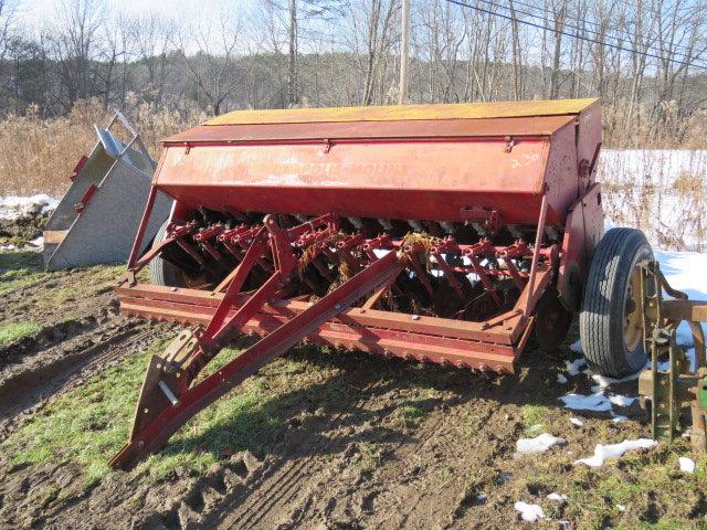 Minneapolis moline grain drill with double disc with grass seed
