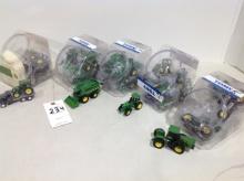 assortment of John Deere tractor's, trucks, combines in containers