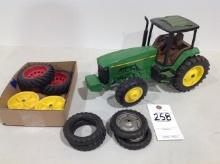 John Deere 8300 tractor missing steps and hood, w/misc. tires and rims
