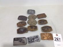 assortment of John Deere belt buckles