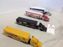 4 racing transporters semis