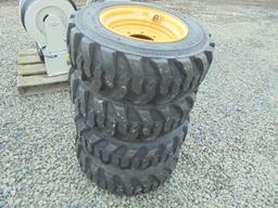 (4) New 10-16.5 SSL Tires On Yellow Rims