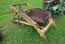 Yellow Loader Off Antique Tractor