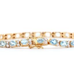 Plated 18KT Yellow Gold 10.45ctw Blue Topaz and Diamond Bracelet