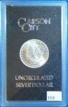 1883CC UNC Morgan Dollar (box and paper).