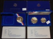 (2) 1986 Liberty Silver Dollars in cases, .900 fine Silver.
