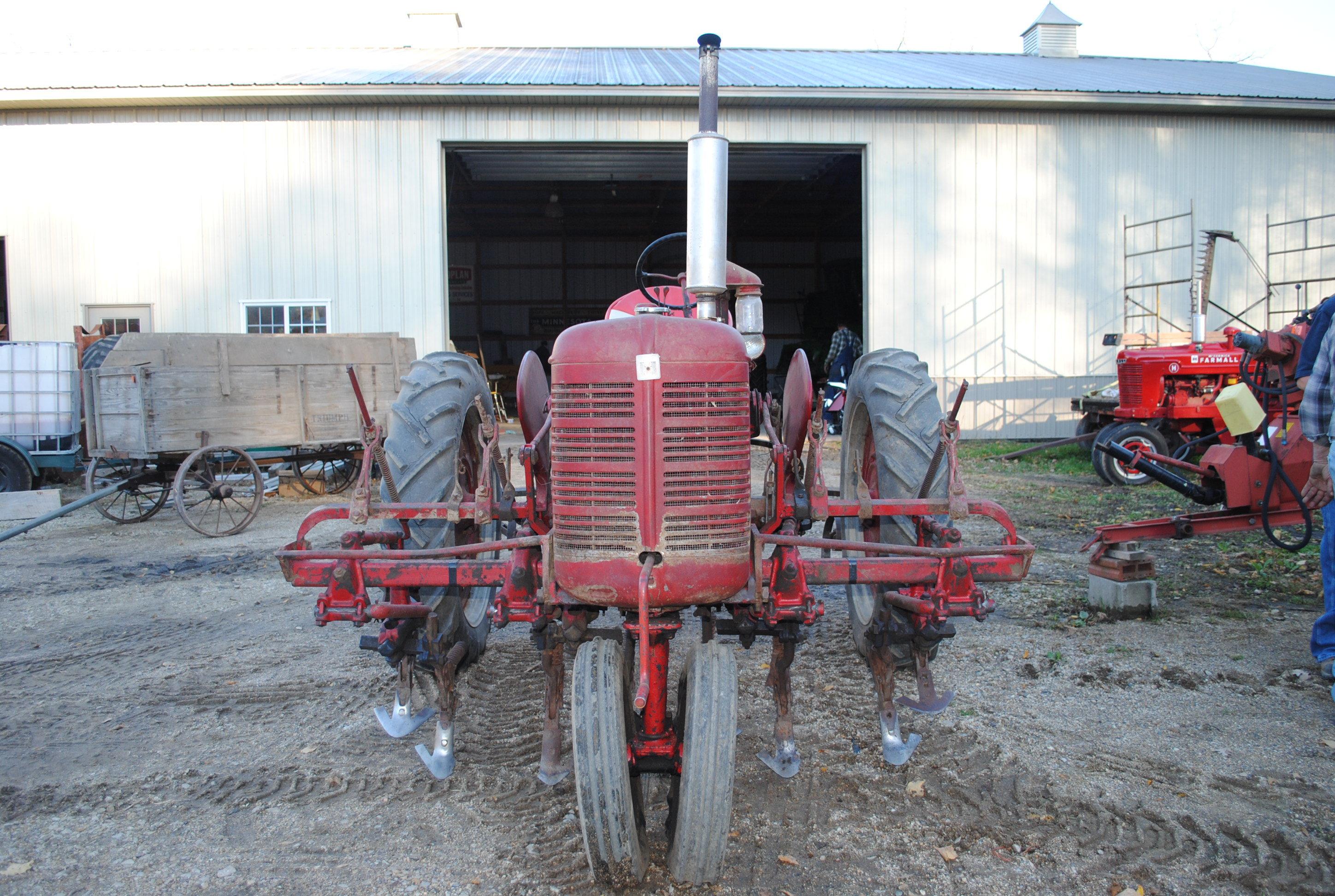 Farmall "C" with 2-row cultivator (only used as cultivator tractor since new), runs nice, the most o