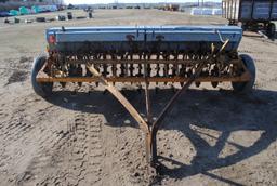 10' Minneapolis Moline grain drill with grass seeder on rubber, has a gear missing