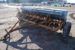 10' Minneapolis Moline grain drill with grass seeder on rubber, has a gear missing
