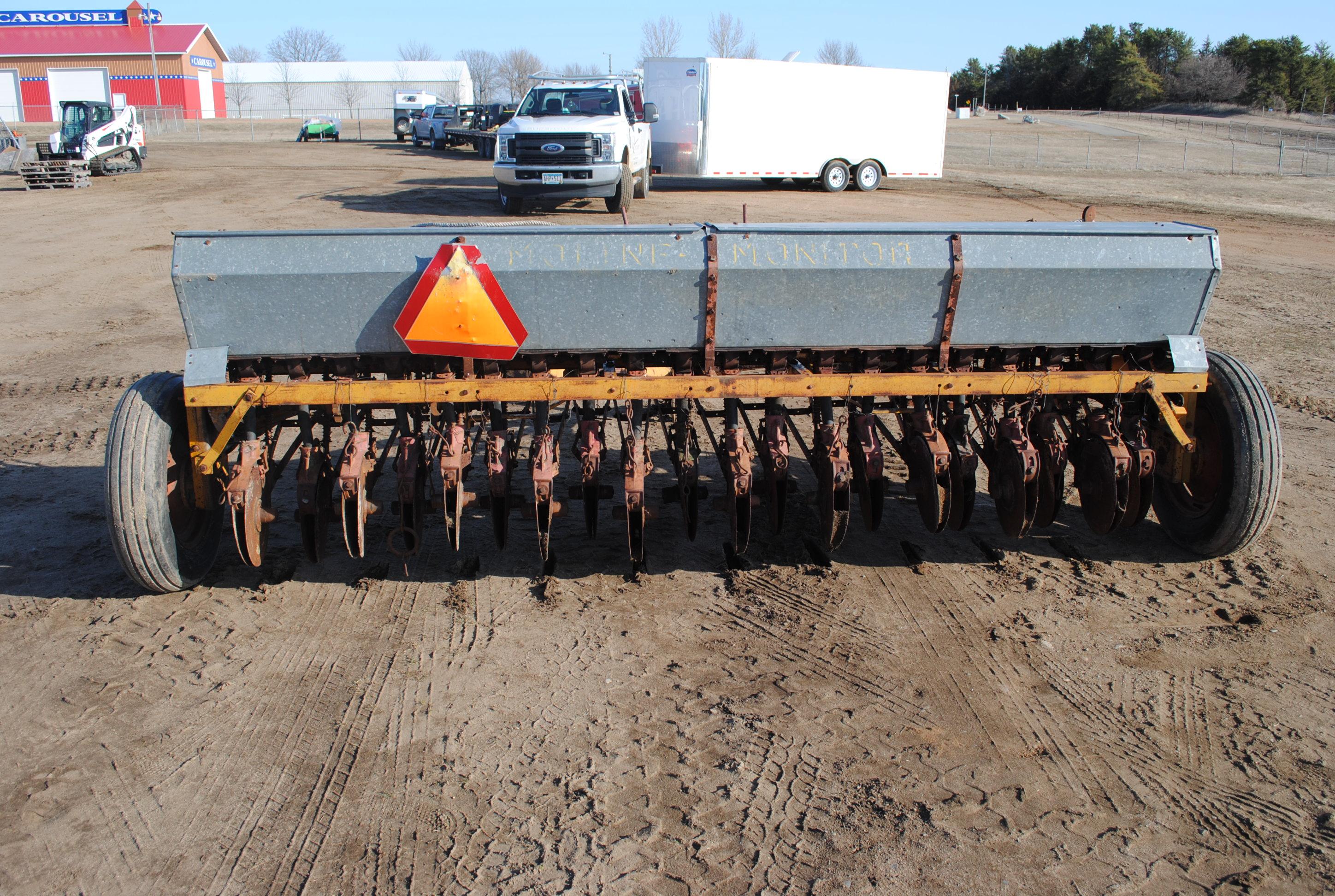 10' Minneapolis Moline grain drill with grass seeder on rubber, has a gear missing