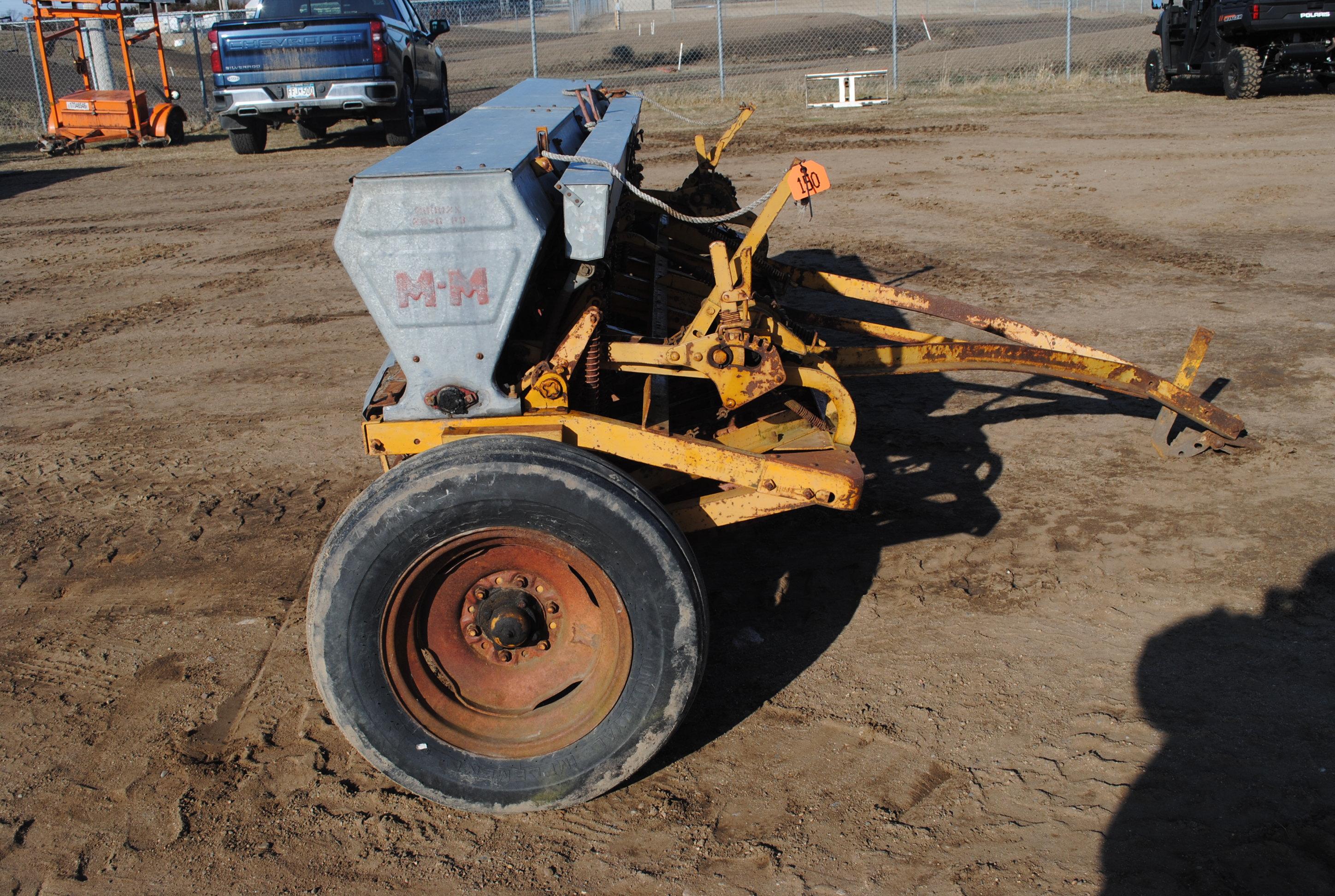 10' Minneapolis Moline grain drill with grass seeder on rubber, has a gear missing