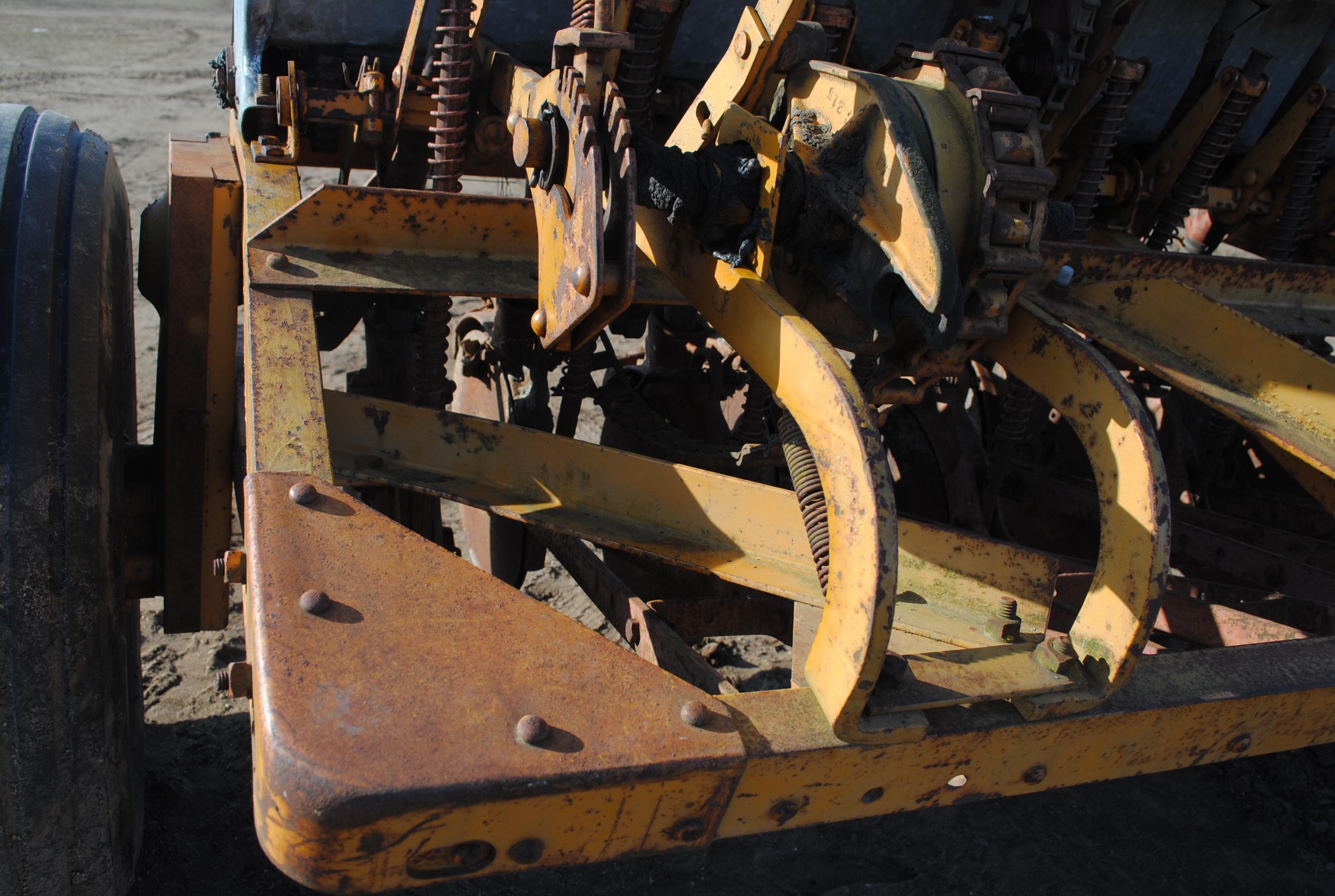 10' Minneapolis Moline grain drill with grass seeder on rubber, has a gear missing