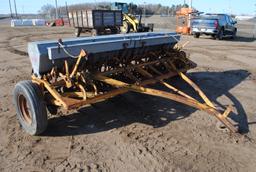 10' Minneapolis Moline grain drill with grass seeder on rubber, has a gear missing