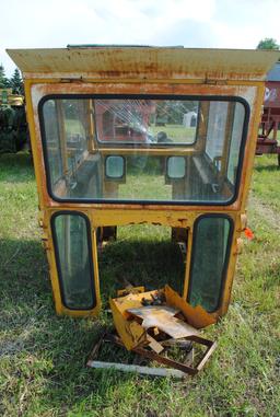 Tractor cab, broken back window