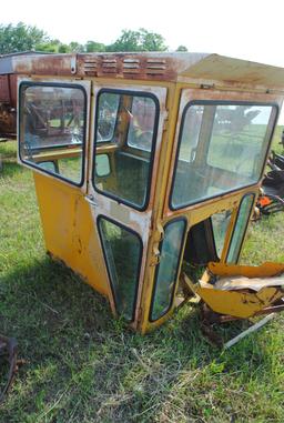 Tractor cab, broken back window