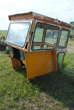Tractor cab, broken back window