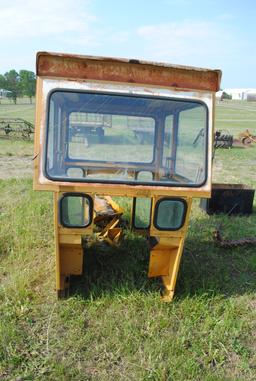 Tractor cab, broken back window